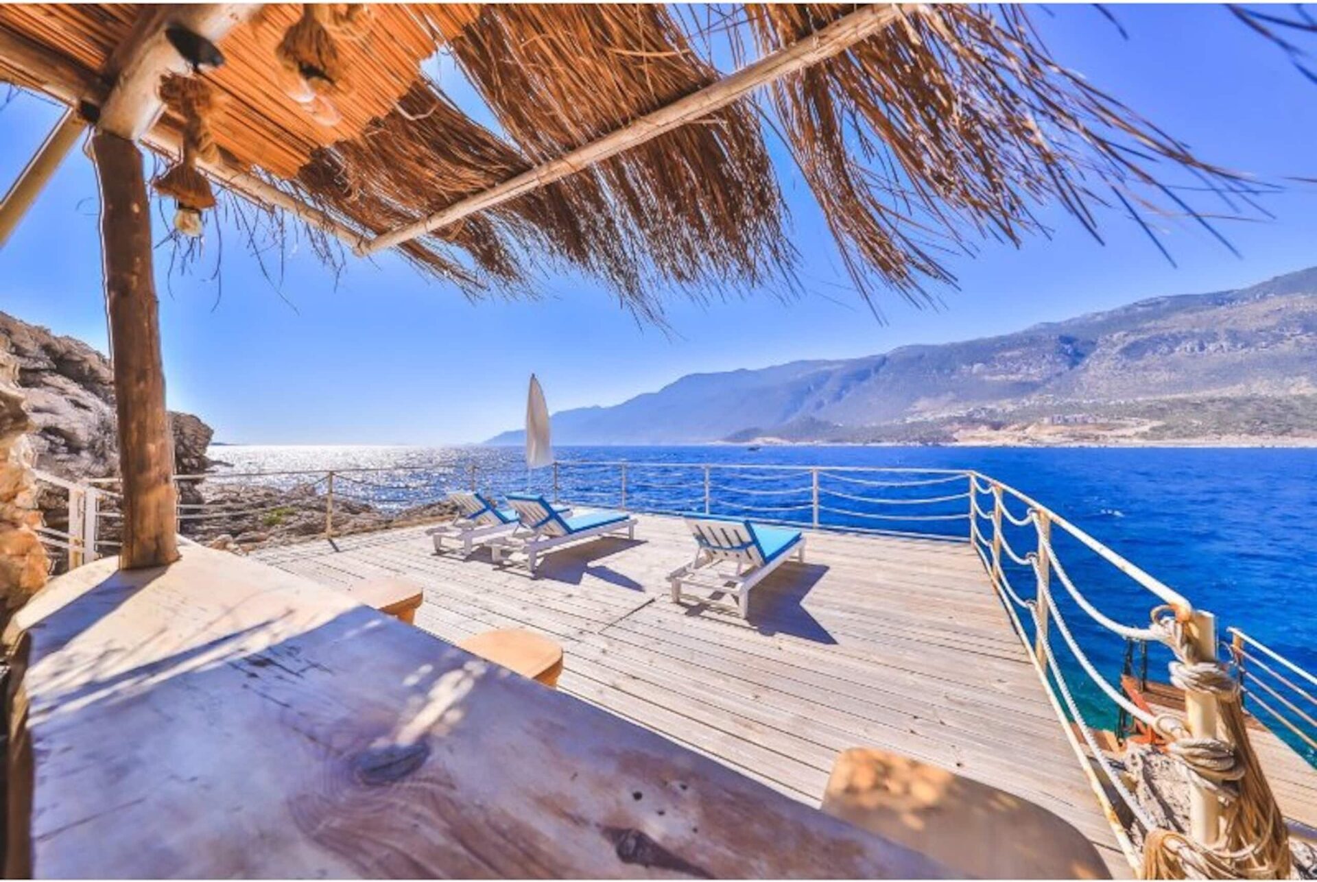Private sea platform with sunbeds and diving board
